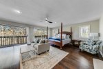 Master bedroom with 4 poster bed & seating area